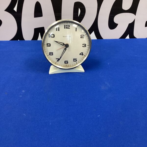 Vintage Westclock alarm clock with cream face and black hands.