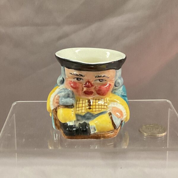Vintage Clarice Cliff toby jug with colourful character design.