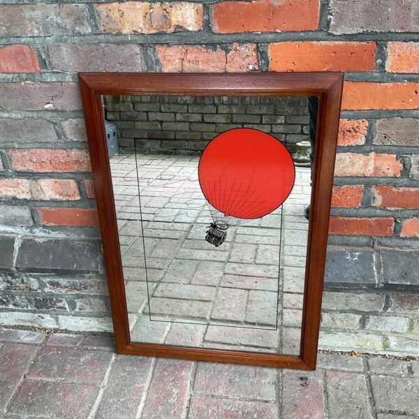 Vintage red hot air balloon mirror for unique wall decor.