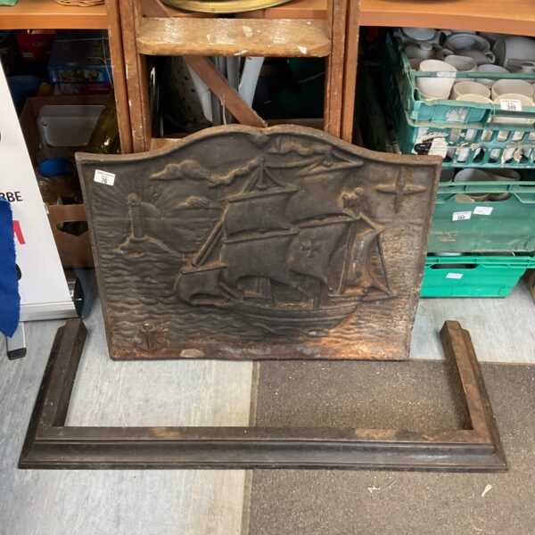 Detailed Victorian cast iron fire back with ship design.