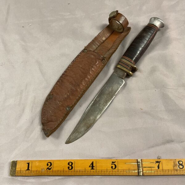 Vintage William Rogers knife with stacked leather handle and sheath.