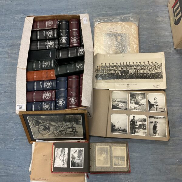 Large collection of vintage photographs in protective sleeves.