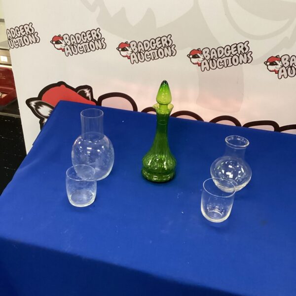 Vintage green glass decanter with water jugs and tumblers.