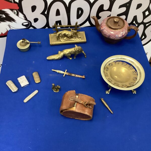 Vintage brass collectibles lot featuring a fox figurine and other ornaments.