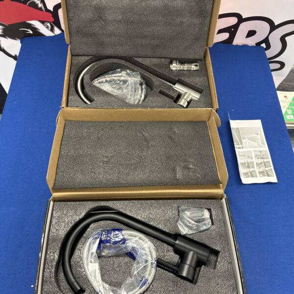 Chrome kitchen mixer tap in original packaging.