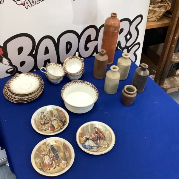 Vintage stone bottles and ceramics in a mixed lot for collectors.