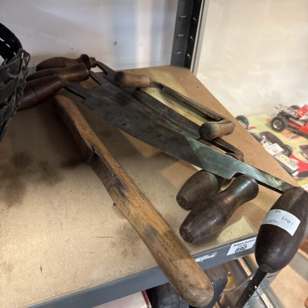 Selection of vintage woodworking tools, including wood planes.
