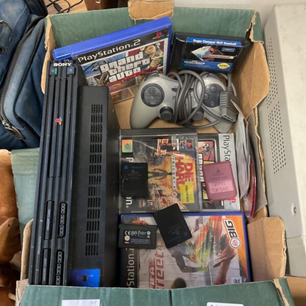 Sony PlayStation 2 console and games lot for retro gaming.