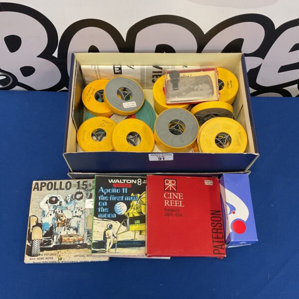 Vintage 8mm film reels including Apollo 11 and 15 space mission footage.