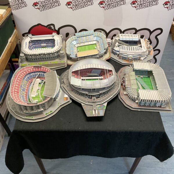 Selection of unassembled football stadium model kits, including Wembley and Real Madrid.