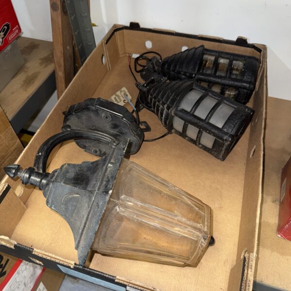 Vintage electric lantern with frosted glass and metal frame.
