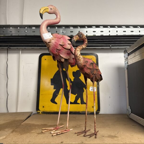 Pair of vintage plastic garden flamingo ornaments for lawn decoration.