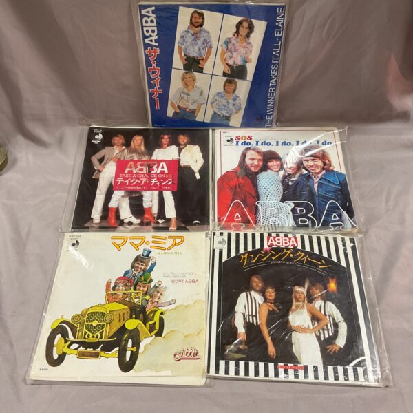 Group of five ABBA Japanese 7” vinyl singles in picture sleeves.