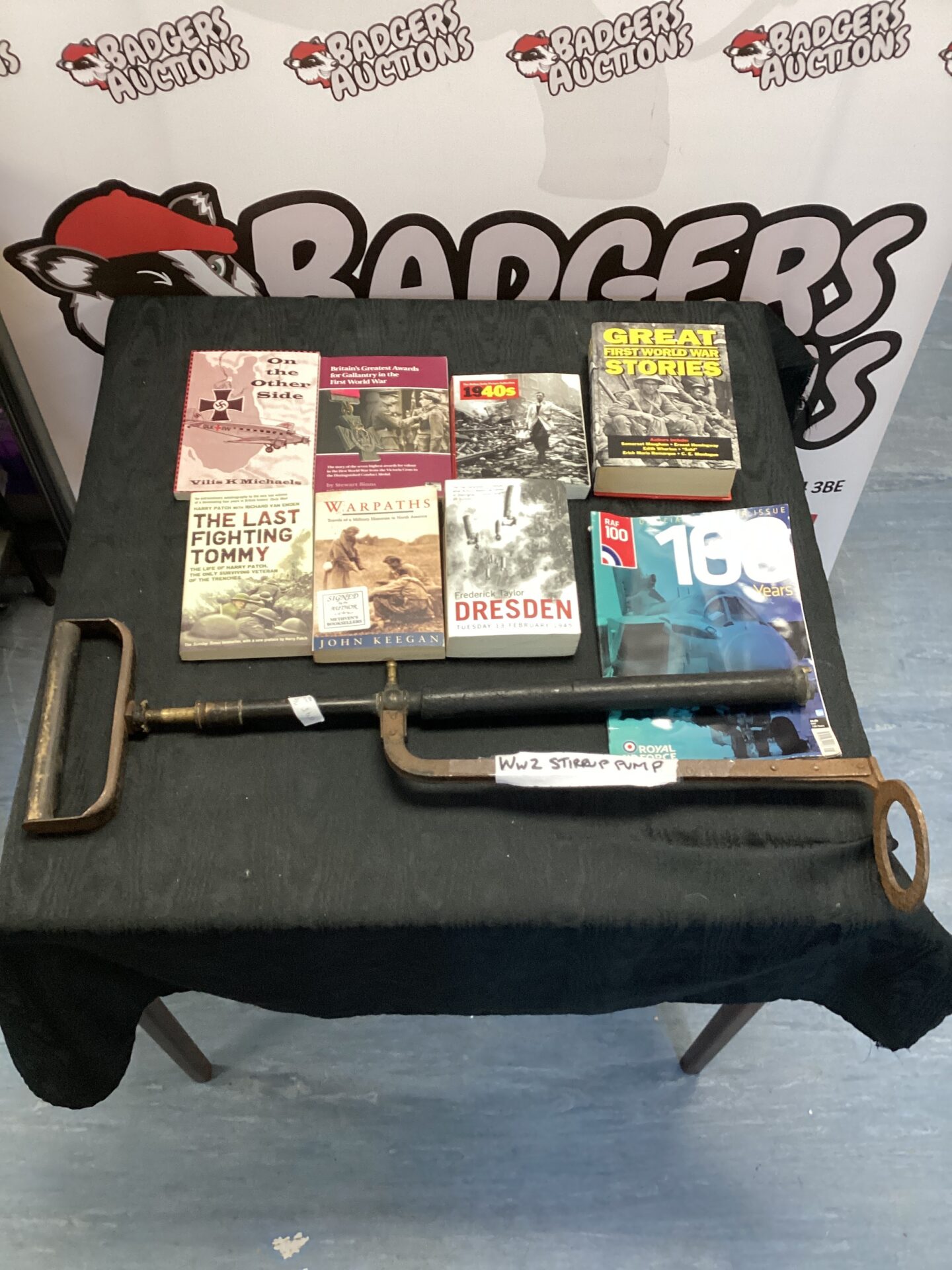 520 W W 2 stirrup pump with a collection of military & war related books