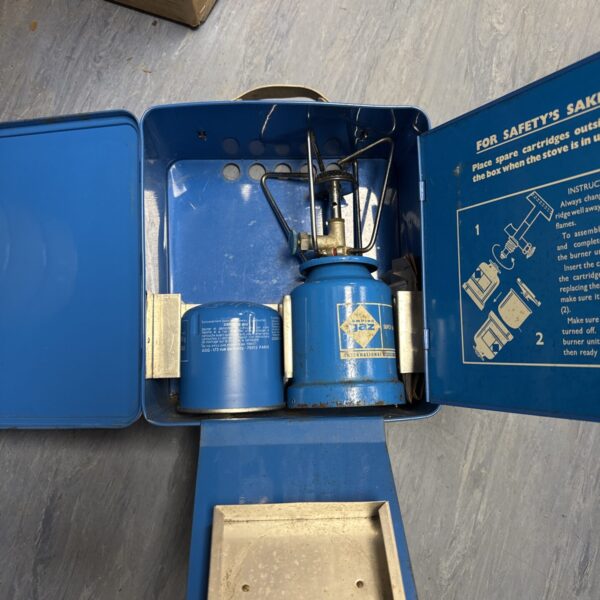 Vintage blue Campingaz stove for outdoor cooking.