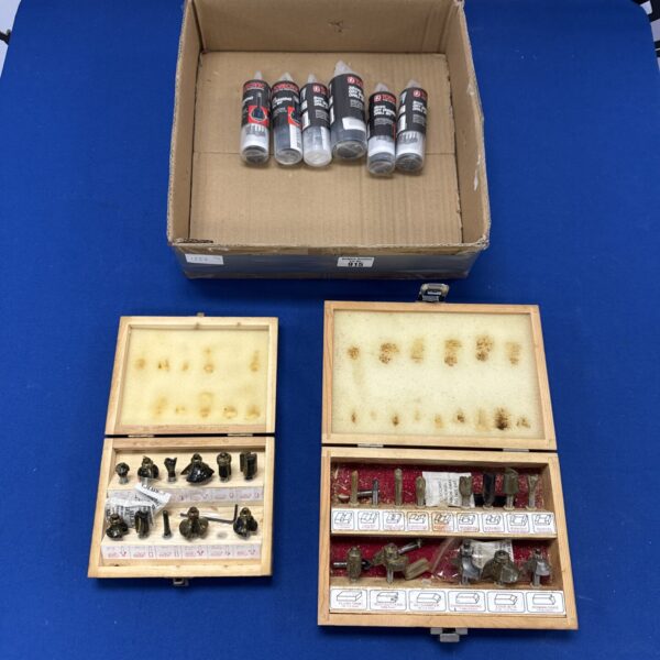 Vintage drill and router bit set in wooden case.