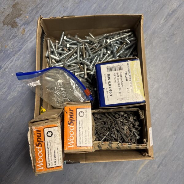 Box of assorted metal screws for DIY projects.
