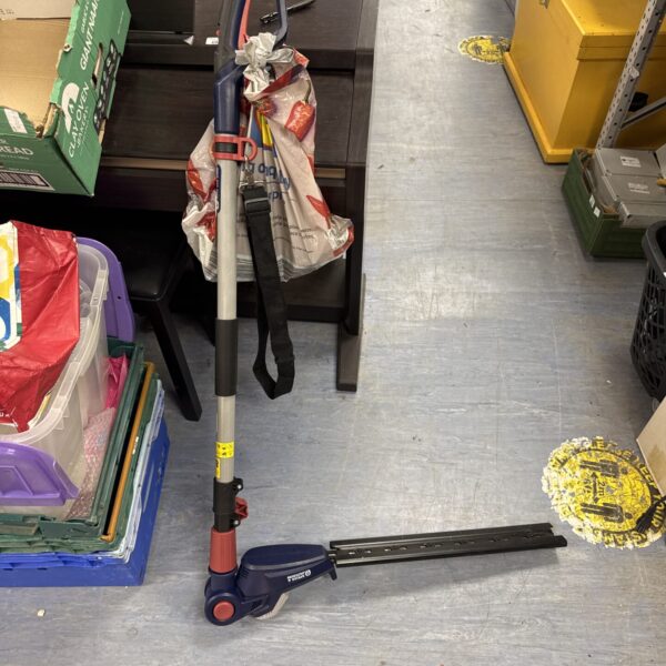 Used Spear & Jackson cordless hedge trimmer with charger and battery.