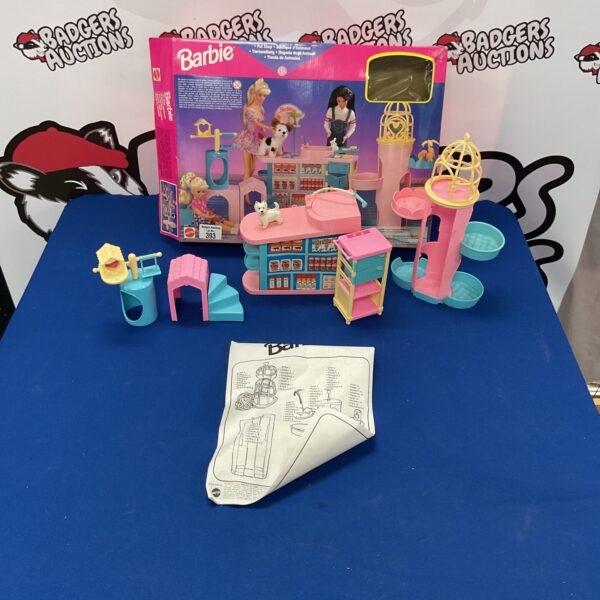 Vintage Barbie Pet Shop playset with colourful storefront and accessories.