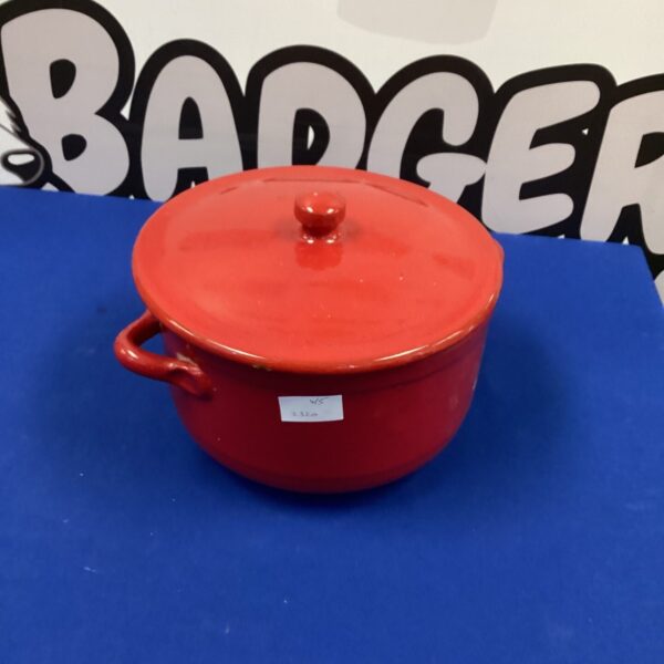 Vintage red cooking pot for stews and soups.