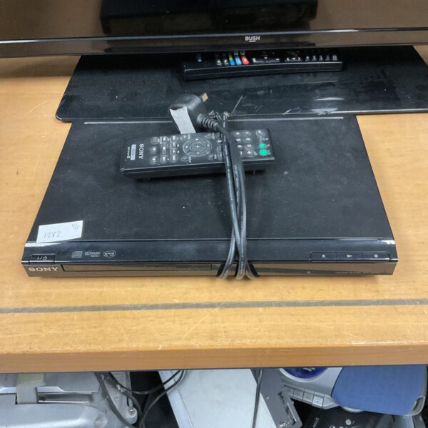 Black Sony DBP-SR150 DVD player with remote control.