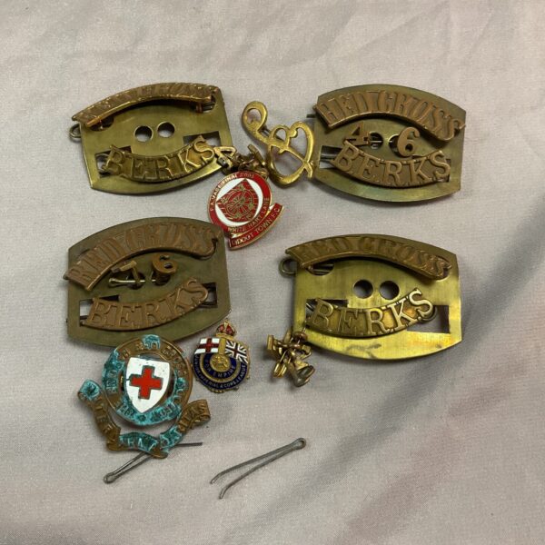 Vintage brass Red Cross shoulder titles marked “Berk’s” from WW1/WW2.