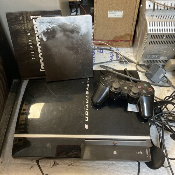 Black Sony PlayStation 3 PS3 console, model CECH-2001A, for retro gaming.