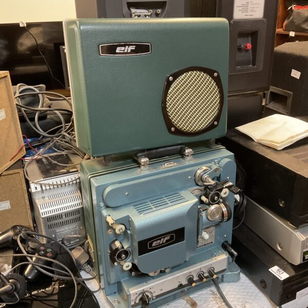 Vintage Elf RM-1 16mm film projector in green metal casing.