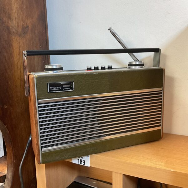 Vintage Roberts R23 three-band transistor radio in wood-effect case.