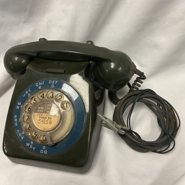Vintage green Potters Bar military telephone with rotary dial.