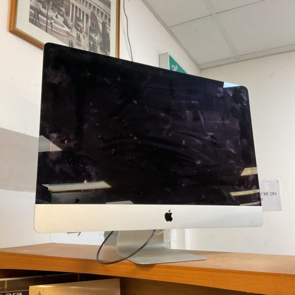 Silver Apple iMac 24 inch computer, model A1419, on a table.