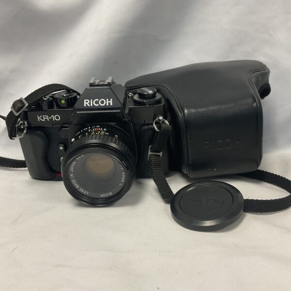 Front view of a vintage Ricoh KR-10 35mm film camera.
