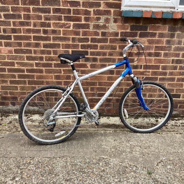 Silver and blue Schwinn Sierra mountain bike for sale.
