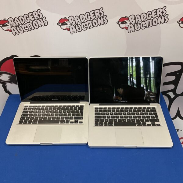 Lot of two used Apple Macbook Pro laptops for auction.