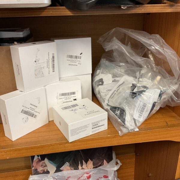 Air Pods accessories lot with charging case and parts.