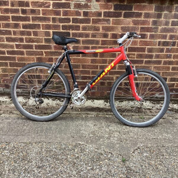 Side view of a vintage Giant Boulder mountain bike.