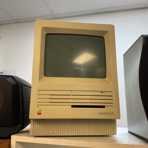 Front view of a vintage Apple Macintosh SE computer.