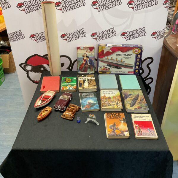 Mixed lot of vintage books, diecast car, and collectibles.