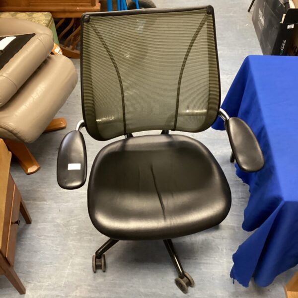 Black leather swivel chair with mesh back for office or home.