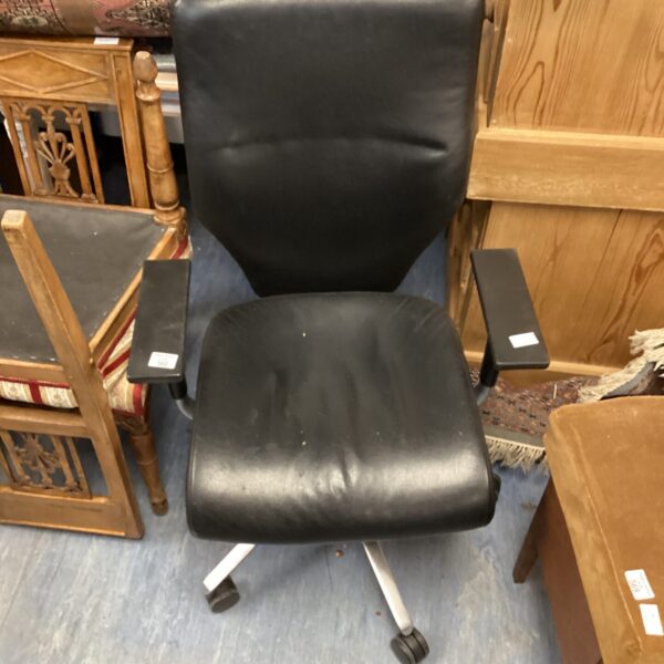 Black leather office chair with swivel base and armrests.