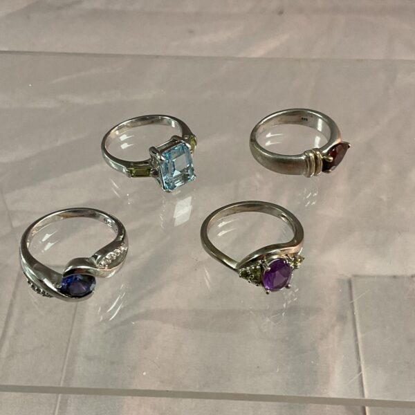 Sterling silver rings with colourful stone settings in a vintage lot.