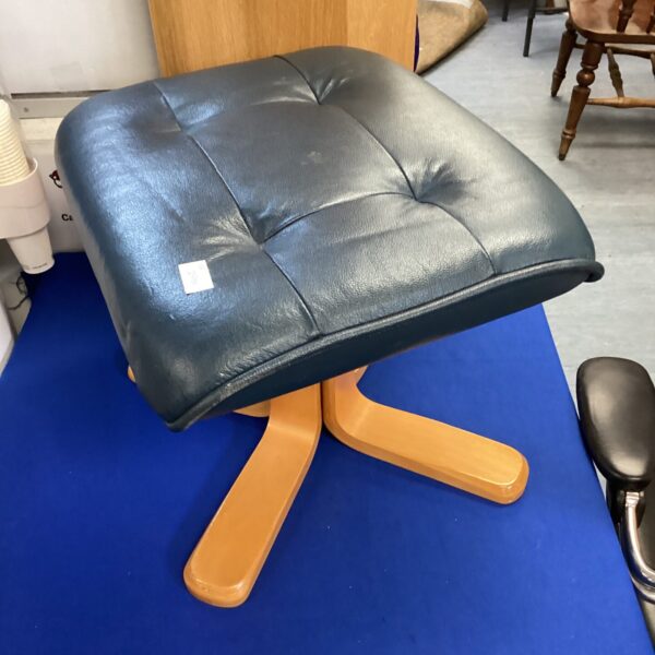Vintage blue leather footstool with wooden legs.