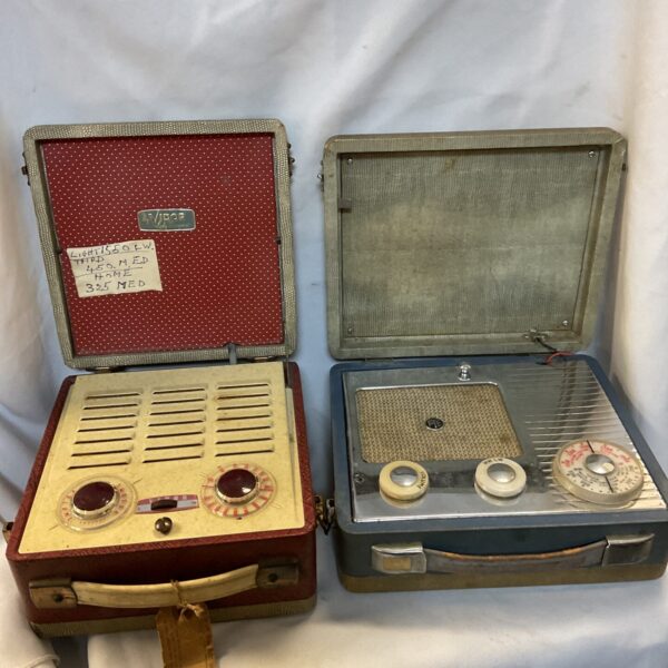 Vintage Vidor Pye transistor radio with red and cream casing.