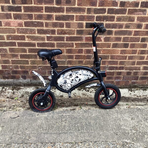 Compact electric folding bike for urban commuting and easy storage.