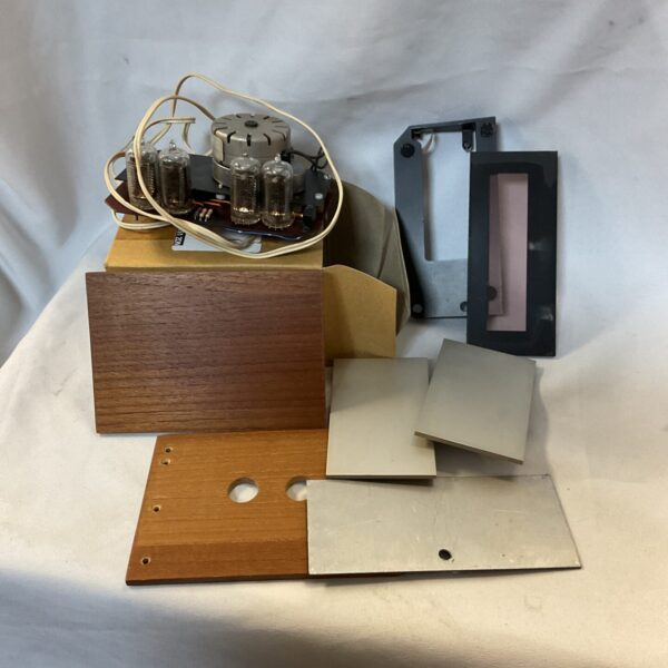 Vintage valve radio kit with wooden cabinet and tubes.