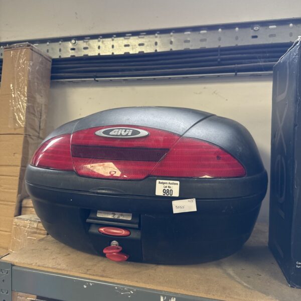 Black Givi motorcycle pillion box for secure storage.
