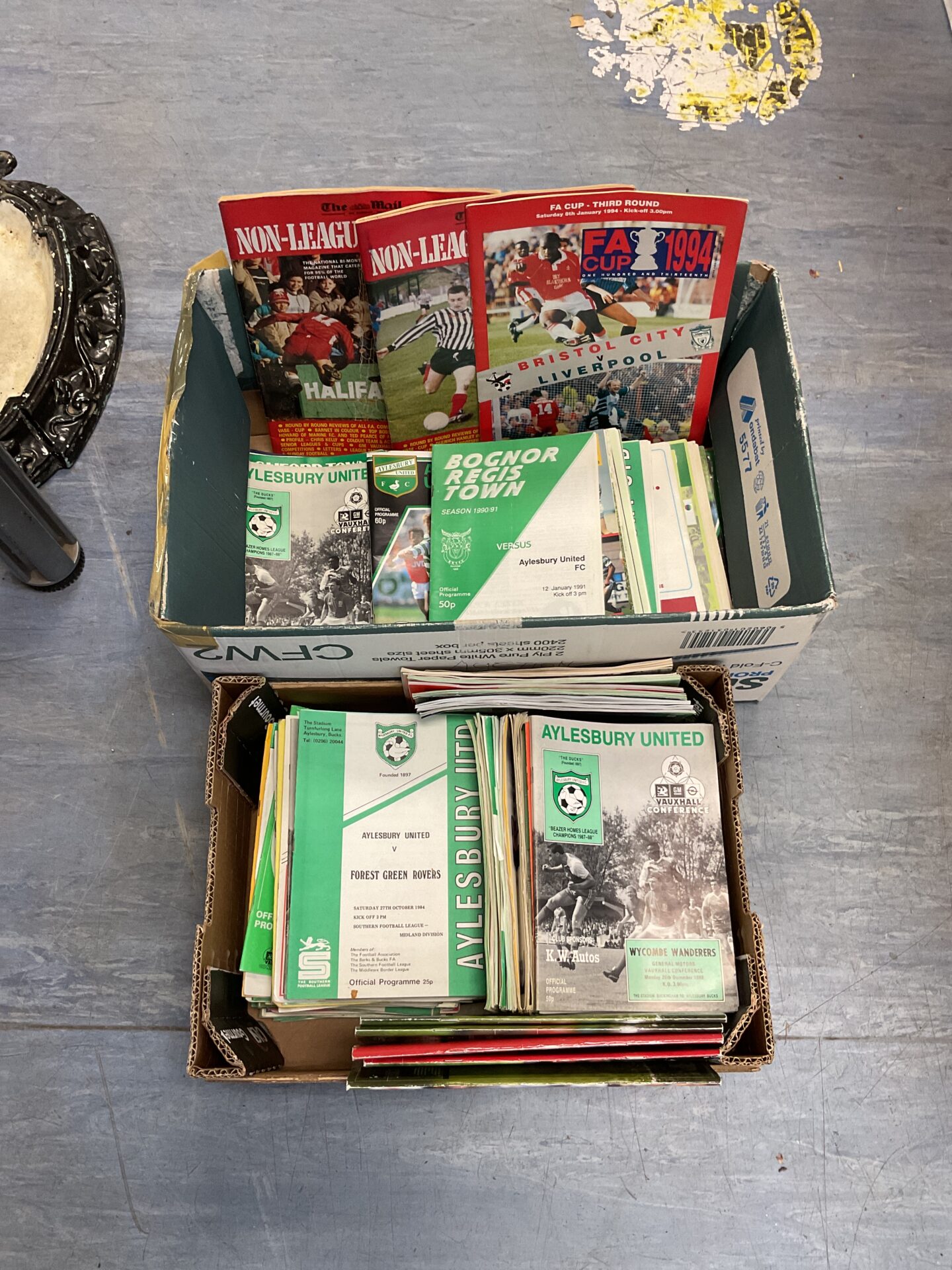 627 Two boxes of Aylesbury united football programs