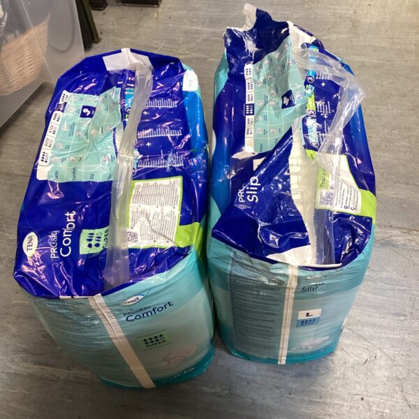 Unopened packs of Tena Super and Large incontinence pads.