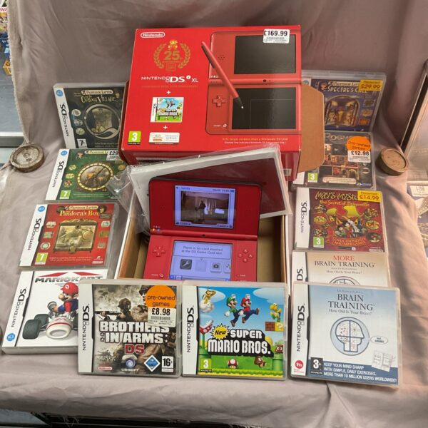 Nintendo DS XL console with eleven included games for portable gaming.