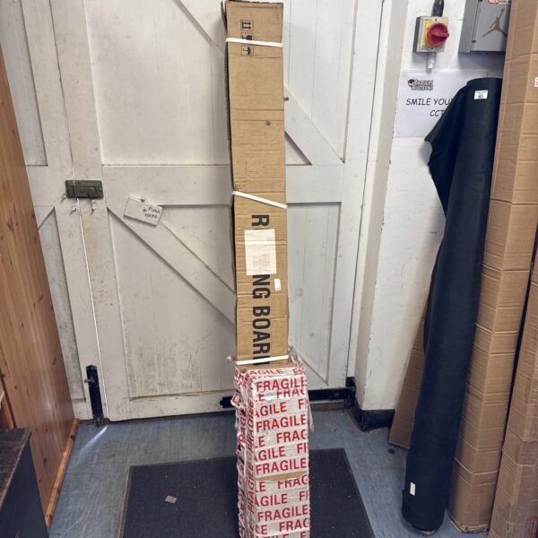 Stack of fragile running boards in cardboard packaging.